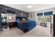 Stylish bedroom featuring blue accent wall, plush carpeting, and natural light at 8316 Waxhaw Hwy, Waxhaw, NC 28173