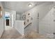 Upstairs hallway featuring multiple art pieces and doors at 8316 Waxhaw Hwy, Waxhaw, NC 28173