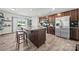 Modern kitchen featuring stainless steel appliances, granite countertops, and a functional center island with barstool seating at 8316 Waxhaw Hwy, Waxhaw, NC 28173