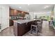 Open-concept kitchen featuring stainless steel appliances, granite countertops, and a view into the living area at 8316 Waxhaw Hwy, Waxhaw, NC 28173