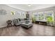 Bright living room with ample natural light, a comfortable sectional sofa, and elegant decor at 8316 Waxhaw Hwy, Waxhaw, NC 28173