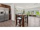Open-concept living space showcasing a kitchen, dining area, and living room with natural light at 8316 Waxhaw Hwy, Waxhaw, NC 28173