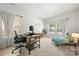 Well-lit office with desk, chair, chaise lounge, and bright windows at 8316 Waxhaw Hwy, Waxhaw, NC 28173