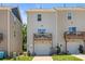 Townhome rear view showcasing a balcony above the garage and a well-kept lawn at 8316 Waxhaw Hwy, Waxhaw, NC 28173