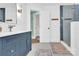 Updated bathroom featuring a modern vanity and a glass-enclosed shower, providing a clean and contemporary look at 832 Kemp Rd, Mooresville, NC 28117