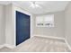 Bright bedroom with neutral carpet, a window, and large closet, ideal for creating a peaceful retreat at 832 Kemp Rd, Mooresville, NC 28117