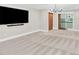 Spacious living room with neutral paint, plush carpeting, television, and stairway view at 832 Kemp Rd, Mooresville, NC 28117