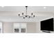 Bright living area with natural light and a chandelier, perfect for gatherings at 832 Kemp Rd, Mooresville, NC 28117