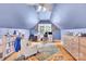 This in-home office features hardwood floors, built-in shelving, and natural light at 832 Kemp Rd, Mooresville, NC 28117