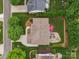 Aerial view of home showcasing patio area with grill, seating, fire pit, and outdoor dining with stone patio at 8921 Whittingham Dr, Waxhaw, NC 28173