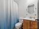 Bathroom with a shower and tub combination. Features a round mirror and vanity at 8921 Whittingham Dr, Waxhaw, NC 28173