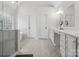 Bright bathroom with a walk-in shower, dual sinks, white cabinets, and modern fixtures for a spa-like experience at 8921 Whittingham Dr, Waxhaw, NC 28173