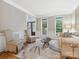 Elegant living room featuring hardwood floors, large windows, stylish seating, and decorative accents for a cozy ambiance at 8921 Whittingham Dr, Waxhaw, NC 28173