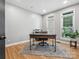 Bright office space featuring hardwood floors, natural light, and a functional desk area perfect for productivity at 8921 Whittingham Dr, Waxhaw, NC 28173