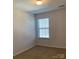 Bedroom featuring carpet, a window offering natural light, and neutral paint at 9170 Bradstreet Commons Way, Charlotte, NC 28215