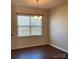 Bright living room featuring wood floors and ample natural light at 9170 Bradstreet Commons Way, Charlotte, NC 28215