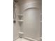 Walk-in shower featuring a built-in seat, alcoves, and modern fixtures at 9170 Bradstreet Commons Way, Charlotte, NC 28215