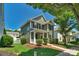 View of a charming home exterior showcasing landscaped lawn, sidewalk and manicured shrubbery at 9227 Island Overlook Ct, Cornelius, NC 28031