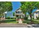 Charming two-story home with a well-manicured front yard, beautiful landscaping, and a welcoming entrance at 9227 Island Overlook Ct, Cornelius, NC 28031