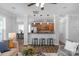 Spacious living room with an open bar area, stainless steel appliances, and an eating area at 9227 Island Overlook Ct, Cornelius, NC 28031