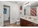 Double sink bathroom with a tile floor, vanity, and a well-lit mirror at 9612 Old Dowd Rd, Charlotte, NC 28214