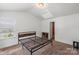 Bedroom with natural light and a sleek metal bed frame at 9612 Old Dowd Rd, Charlotte, NC 28214