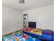Bright bedroom with kid-friendly decor, carpeted floors, and ample space at 9612 Old Dowd Rd, Charlotte, NC 28214