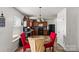 Eat-in kitchen features dark cabinets, black appliances, and a bright breakfast nook at 9612 Old Dowd Rd, Charlotte, NC 28214