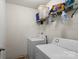 Laundry room with appliances and storage shelves at 9612 Old Dowd Rd, Charlotte, NC 28214