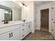 Modern bathroom featuring a dual sink vanity with quartz countertop, a glass-enclosed shower, and tile flooring at 102 Cartington Way # Haf0042, Mooresville, NC 28115
