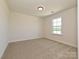 A serene bedroom with soft carpet and natural light streaming through the window creates a peaceful atmosphere at 102 Cartington Way # Haf0042, Mooresville, NC 28115