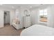 Bright bedroom with white walls and an alcove with bench seating at 102 Cartington Way # Haf0042, Mooresville, NC 28115