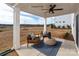 Relaxing covered patio featuring comfortable seating and a ceiling fan, perfect for enjoying the outdoors at 102 Cartington Way # Haf0042, Mooresville, NC 28115