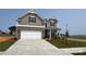 Charming two-story home with a brick and siding facade and an attached garage at 102 Cartington Way # Haf0042, Mooresville, NC 28115