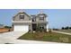 Charming two-story home with a brick and siding facade and an attached garage at 102 Cartington Way # Haf0042, Mooresville, NC 28115