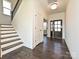 Inviting foyer with hardwood floors, staircase, and a view of the front door, creating a grand entrance at 102 Cartington Way # Haf0042, Mooresville, NC 28115