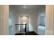 Hallway with hardwood floors and a staircase featuring dark wood banisters and spindles at 102 Cartington Way # Haf0042, Mooresville, NC 28115