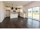 Open-concept kitchen featuring a central island, stainless appliances, and a large sliding door to the backyard at 102 Cartington Way # Haf0042, Mooresville, NC 28115