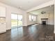 View of kitchen area from living room, featuring stainless steel appliances and access to the outdoors at 102 Cartington Way # Haf0042, Mooresville, NC 28115