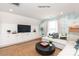 Comfortable living room with built-in storage, a sectional sofa, and stylish decor at 102 Cartington Way # Haf0042, Mooresville, NC 28115