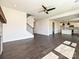 Open-concept living room featuring a staircase and view of a modern kitchen at 102 Cartington Way # Haf0042, Mooresville, NC 28115