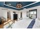 Main bedroom with custom ceiling, large mirror, and adjoining ensuite at 102 Cartington Way # Haf0042, Mooresville, NC 28115