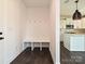 Mudroom features a bench and storage with access to a bright kitchen with a center island at 102 Cartington Way # Haf0042, Mooresville, NC 28115