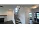 Staircase to the upper level of the home with dark wood steps and iron railing at 102 Cartington Way # Haf0042, Mooresville, NC 28115