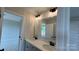 Bright bathroom vanity with double sink and lighting fixtures at 113 Tonbridge Way # Haf0031, Mooresville, NC 28115