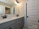 Modern bathroom featuring double sinks, gray cabinets, and stylish tile flooring at 113 Tonbridge Way # Haf0031, Mooresville, NC 28115