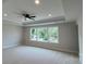 Spacious Primary bedroom with large windows, ceiling fan, and tray ceiling at 113 Tonbridge Way # Haf0031, Mooresville, NC 28115