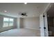 Spacious bedroom with neutral carpet and fan at 113 Tonbridge Way # Haf0031, Mooresville, NC 28115