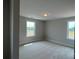 Sunlit bedroom featuring two windows and neutral carpet at 113 Tonbridge Way # Haf0031, Mooresville, NC 28115