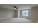 Large carpeted bedroom featuring a ceiling fan and ample natural light at 113 Tonbridge Way # Haf0031, Mooresville, NC 28115